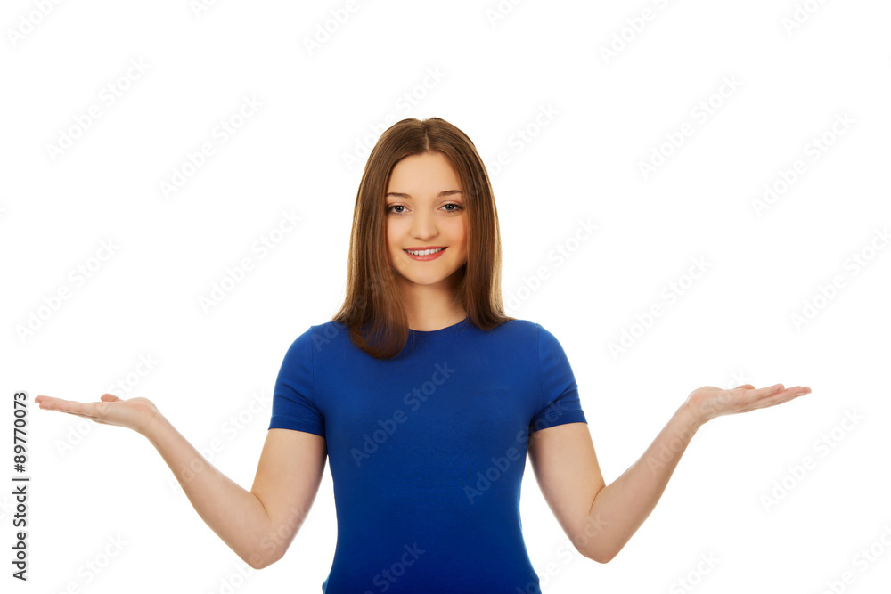 Smiling woman showing something on palms. Smiling woman showing something on palms.