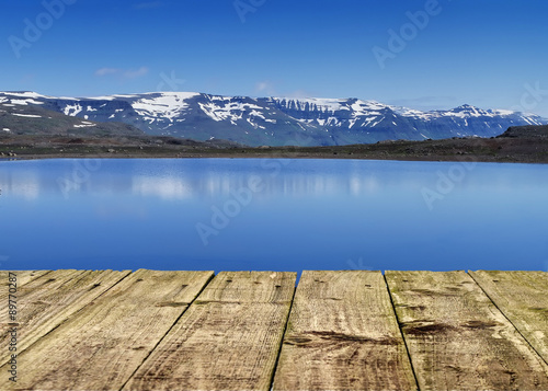 Panorama snow mountains and lake from wooden pier © leksele