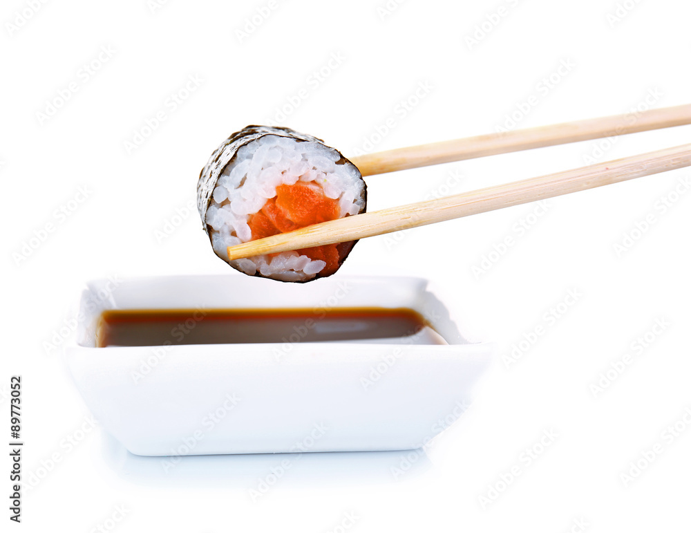 Dipping roll in sauce isolated on white Dipping roll in sauce isolated on white