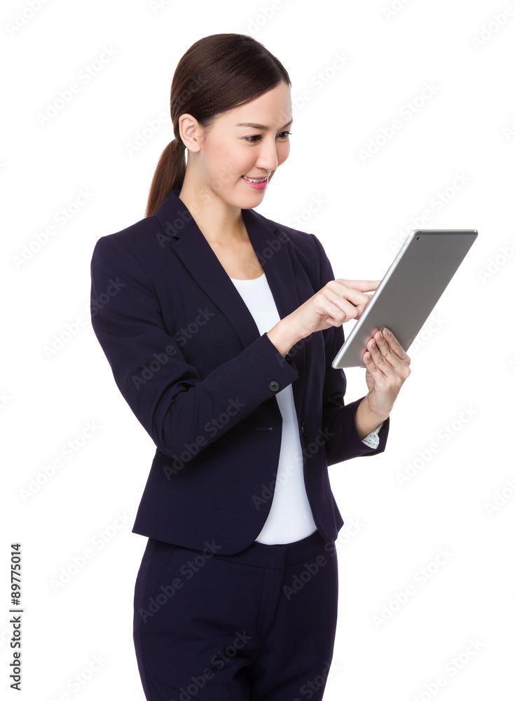 Asian young businesswoman use of the digital tablet Asian young businesswoman use of the digital tablet