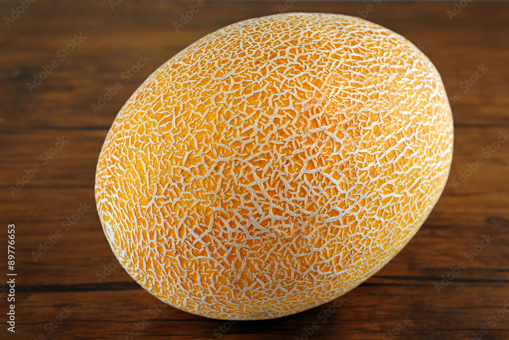 Ripe melon on wooden background Ripe melon on wooden background