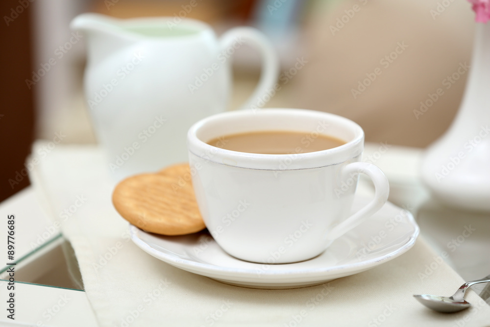 Cup of coffee on table in living room Cup of coffee on table in living room