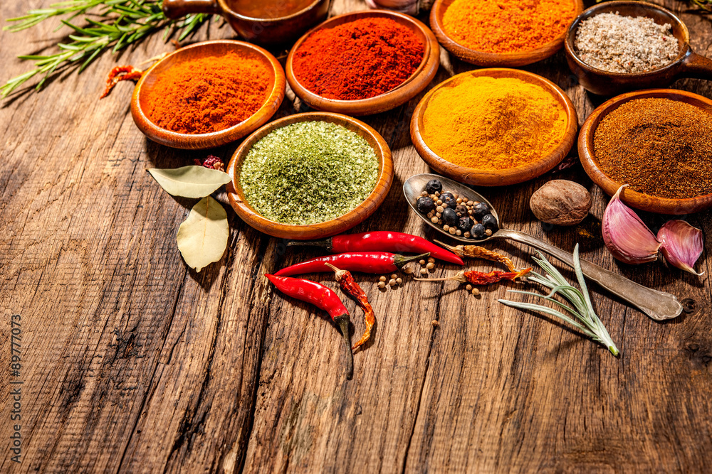 Herbs and spices on wooden table Herbs and spices on wooden table