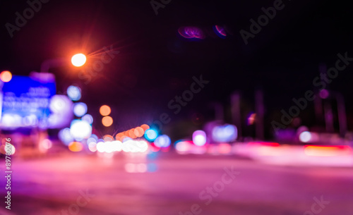 image of blur street  bokeh background with purple tone lights © coffmancmu