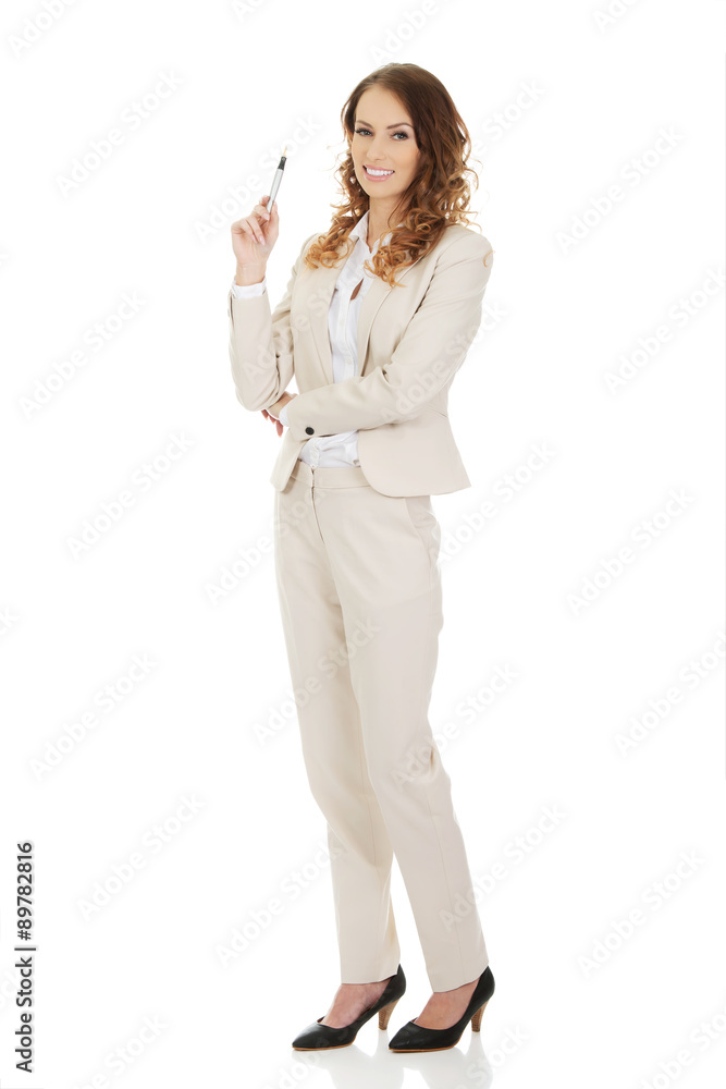 Businesswoman holding a pen. Businesswoman holding a pen.