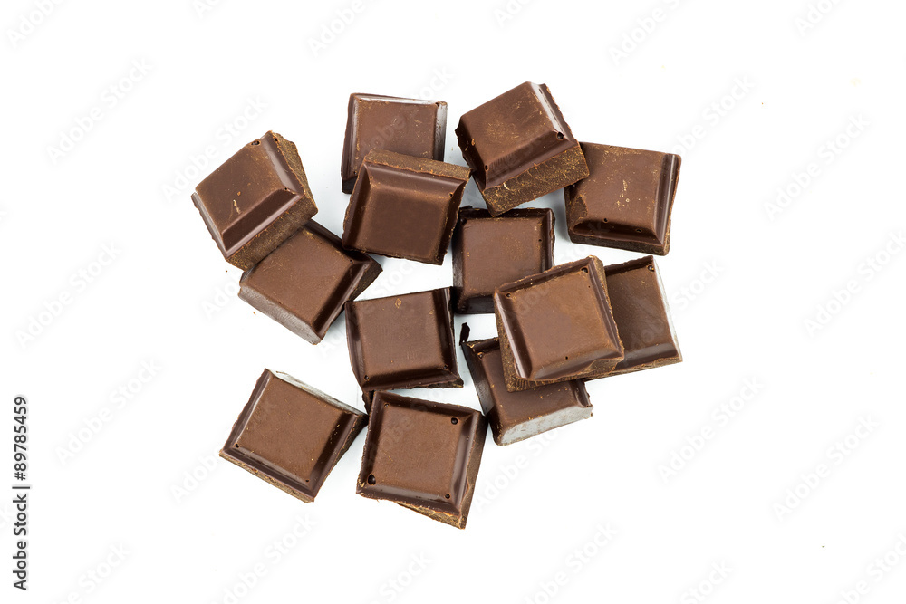 Broken black chocolate bar isolated on white background Broken black chocolate bar isolated on white background