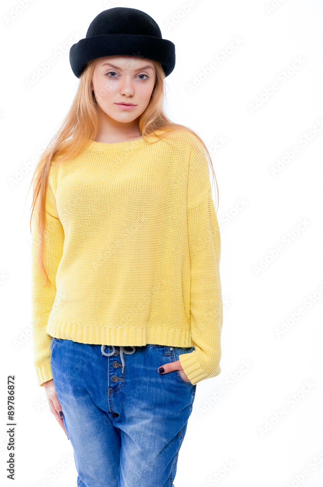 Teenage girl or young woman in yellow sweater and black hat look Teenage girl or young woman in yellow sweater and black hat look