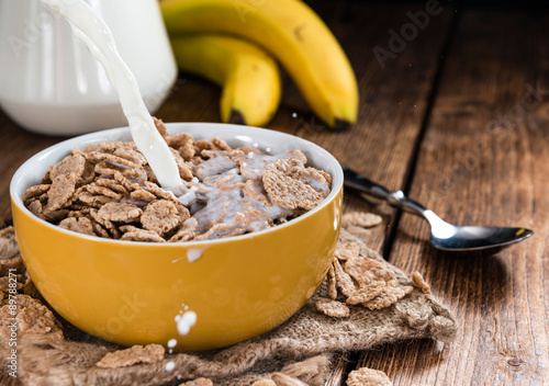 Pouring Milk on a portion of Cornflakes photo