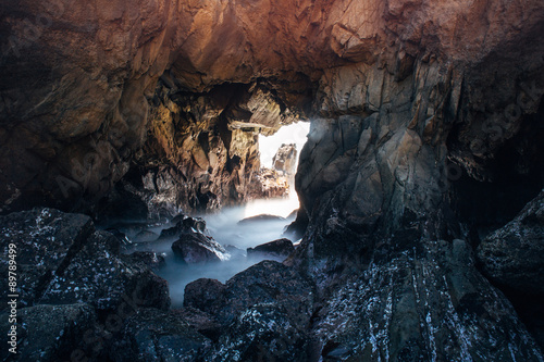 Dramatic rock tunnel on Pacific coast