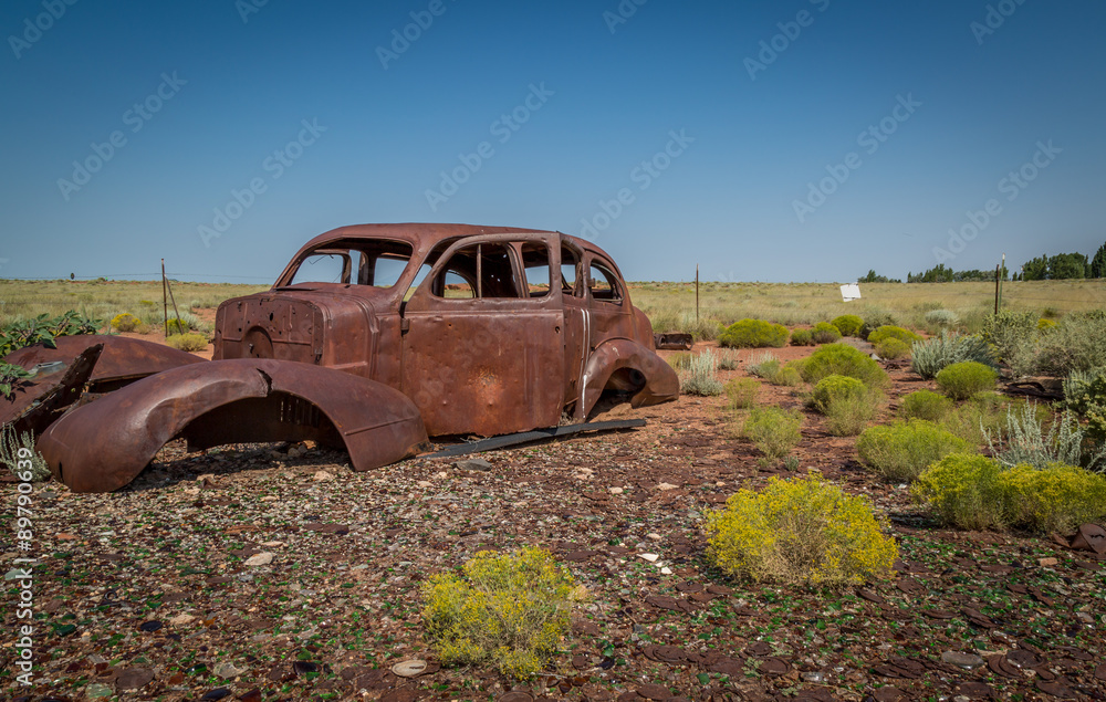 Fototapeta premium Classic Old Car decays in a meadow. 
