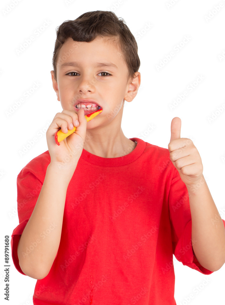 Young boy brushing his teeth signing OK
Young boy brushing his teeth signing OK