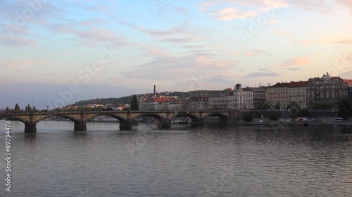Vltava River with the Palacky bridge & Smichov district (Prague 5) from the Jirasek Bridge at sunset.  photo