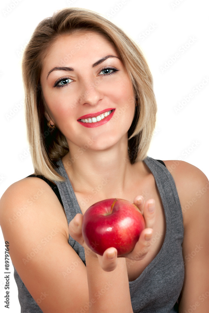 Beautiful woman holding a red apple on a white background Beautiful woman holding a red apple on a white background