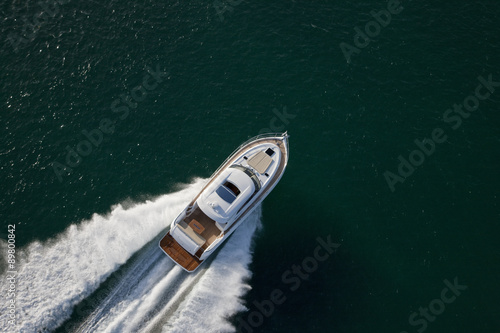 Speed boat sailing through a deep sea © Image Supply Co