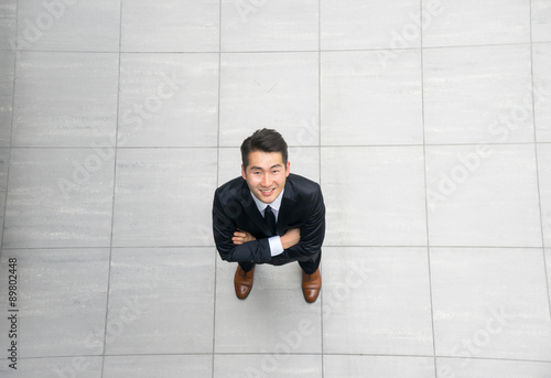 Schilderij op canvas Asian young & success businessman from top view, high angle