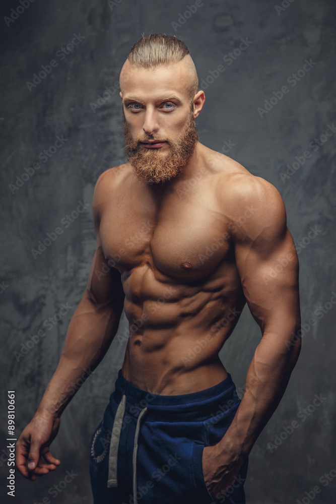 Portrait of awesome muscular guy with beard.