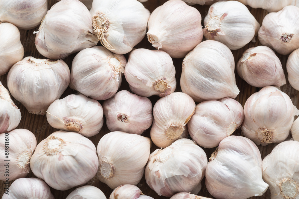 Garlic on the wooden background, top view. Garlic on the wooden background, top view.