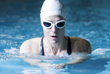 female swimmer doing breaststroke exercise.