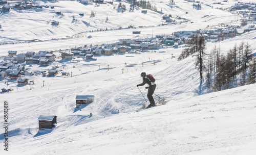 Skier on the slope of Ski resort Livigno. Italy