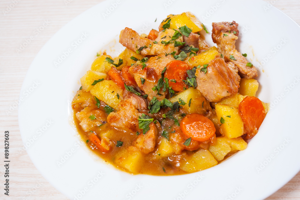 stewed meat with potatoes, onion and carrot stewed meat with potatoes, onion and carrot