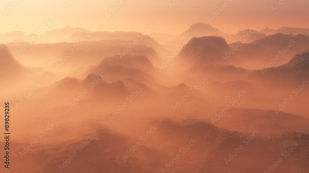 Mountain range glowing in the mist at sunrise. Aerial view. Mountain range glowing in the mist at sunrise. Aerial view.