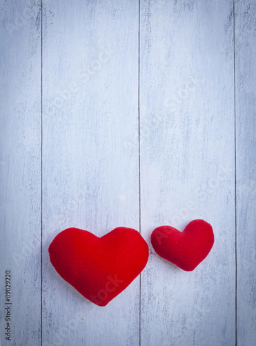 Red hearts on wooden floor vertical style