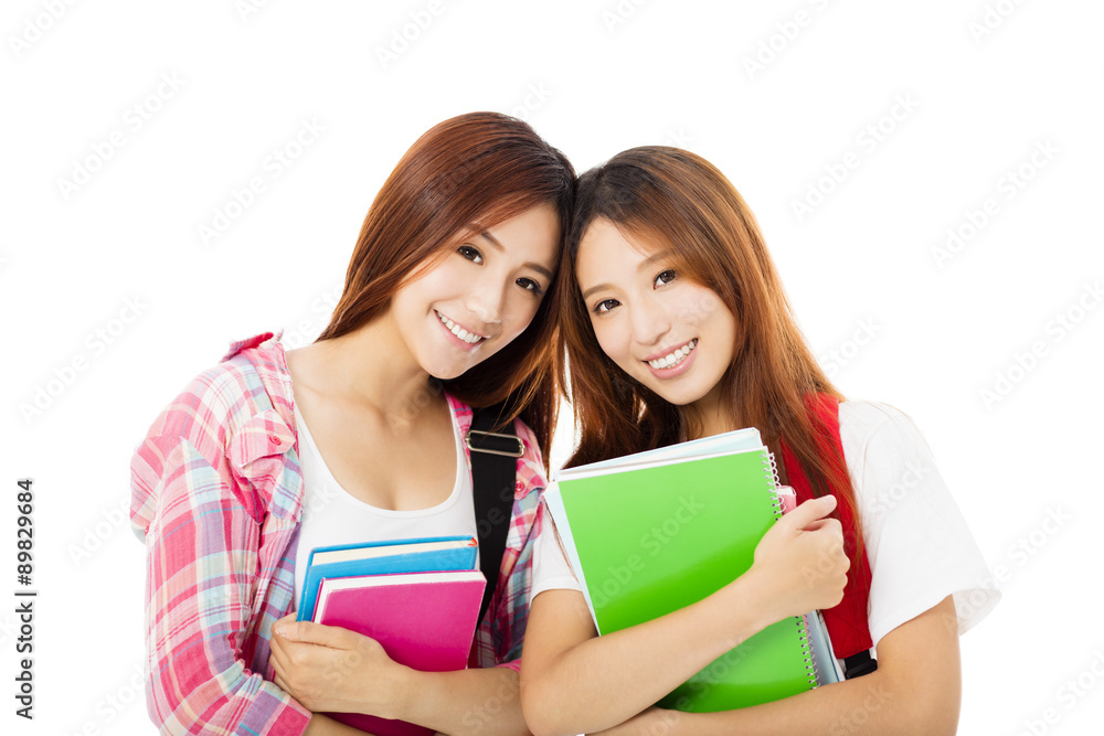 Two happy teenage students girls isolated on white Two happy teenage students girls isolated on white