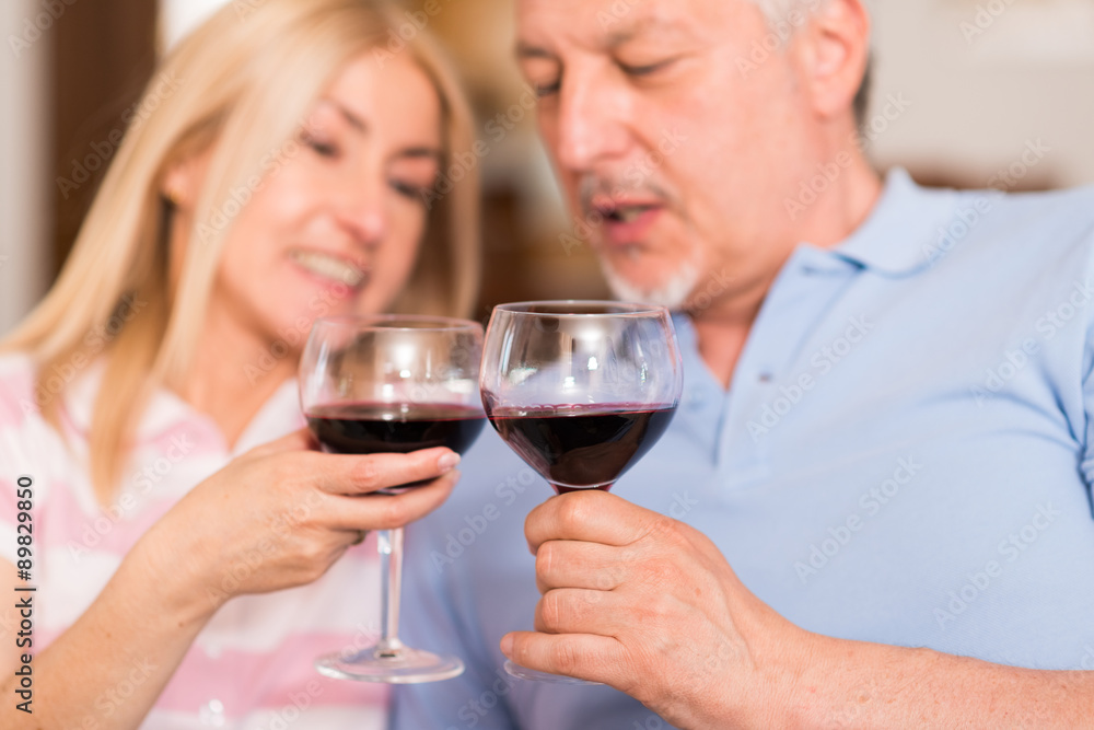 Mature couple drinking a glass of red wine Mature couple drinking a glass of red wine