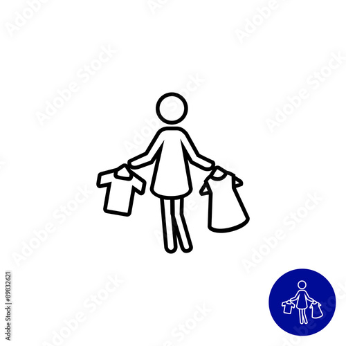 Woman holding clothes on hangers