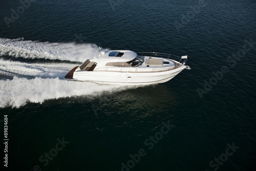 A fast motor boat sailing through the sea © Image Supply Co