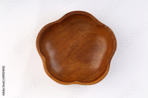 Top view of Flower shape wooden bolw isolated on white backgroun