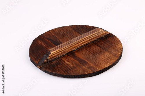 Old wooden lid isolated on white background