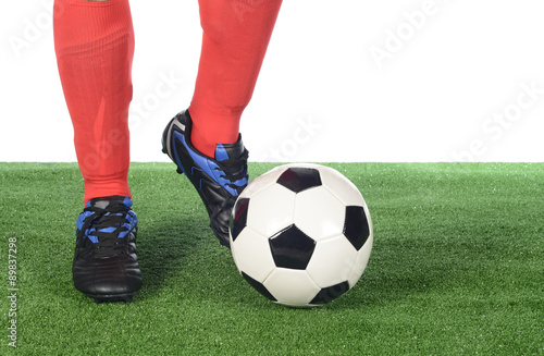 Jugador y balón de fútbol © imstock