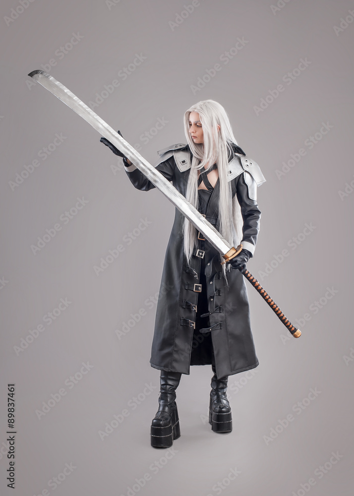 Fantasy woman warrior / Woman warrior with sword and armor isolated on the gray background Fantasy woman warrior / Woman warrior with sword and armor isolated on the gray background