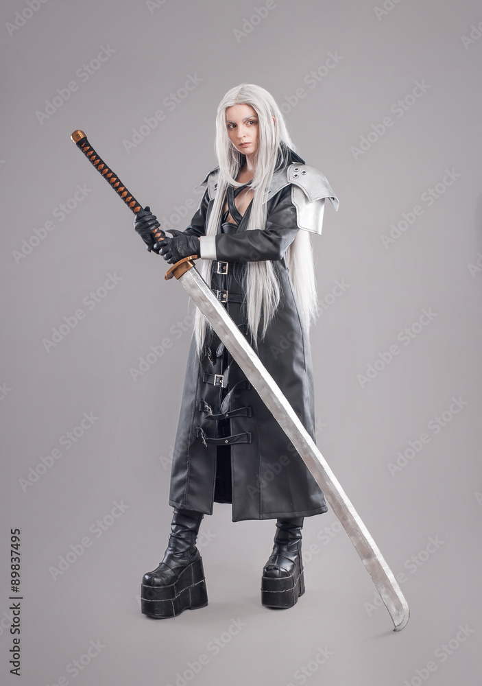 Fantasy woman warrior / Woman warrior with sword and armor isolated on the gray background Fantasy woman warrior / Woman warrior with sword and armor isolated on the gray background