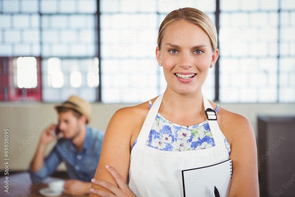 Portrait of a beautiful waitress taking an order Portrait of a beautiful waitress taking an order