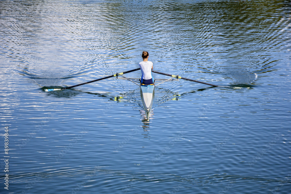 Young Women Rower in a boat - obrazy, fototapety, plakaty 