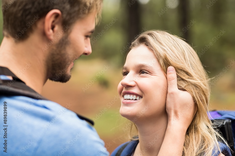 Young happy hiker couple looking at each other Young happy hiker couple looking at each other