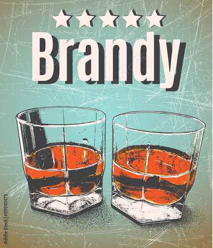 Brandy in glasses on grunge background