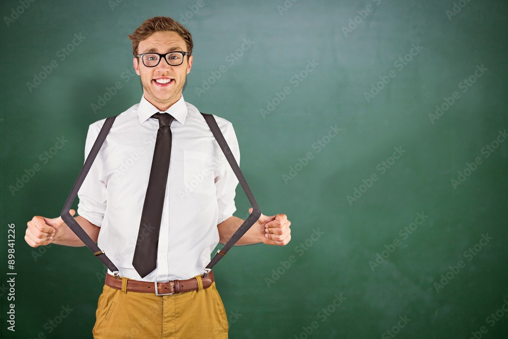 Composite image of geeky businessman pulling his suspenders