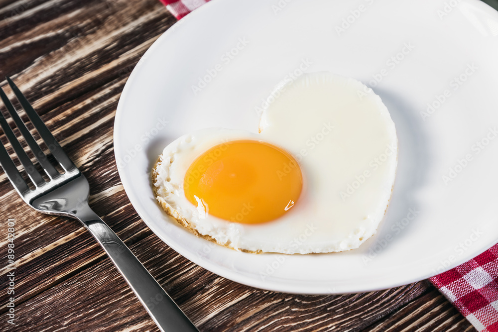 heart-shaped fried eggs in a plate heart-shaped fried eggs in a plate