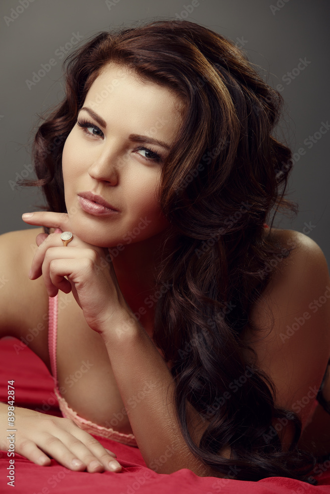 Charming brunette posing at camera, close-up Charming brunette posing at camera, close-up