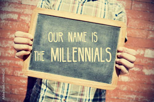 Obraz na plátně text our name is the millennials in a chalkboard, vignetted