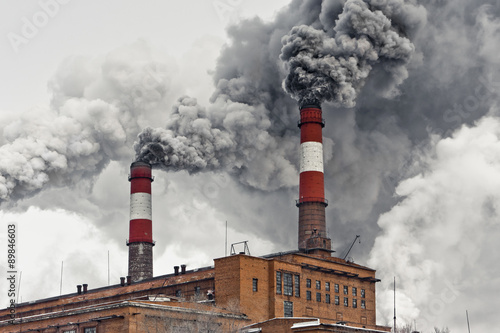 Quadro em tela Smoking industrial pipes.