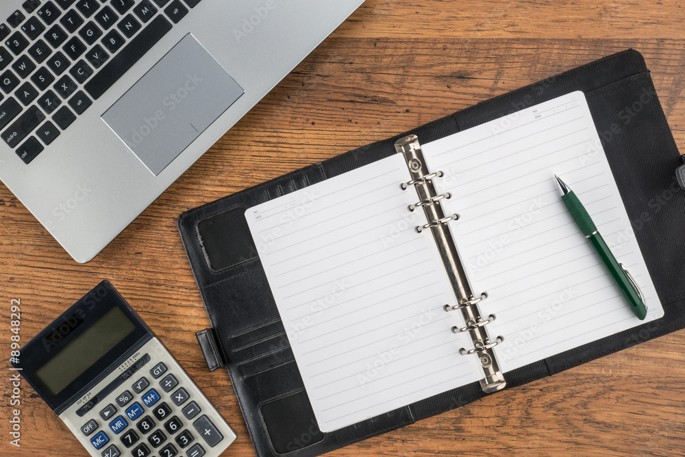 notebook and pen with calculator on the desk notebook and pen with calculator on the desk