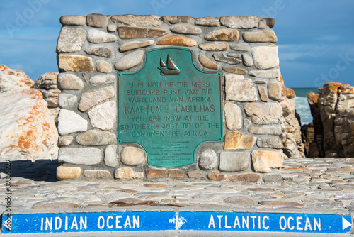 A sign showing information about Cape Algulhas, South Africa photo