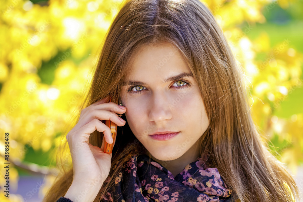 Happy beautiful woman calling by phone Happy beautiful woman calling by phone