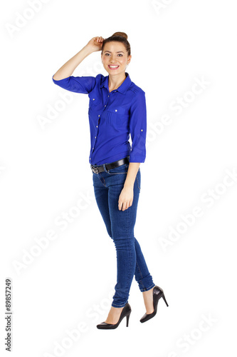 Portrait of a beautiful woman in blue jeans and blue shirt