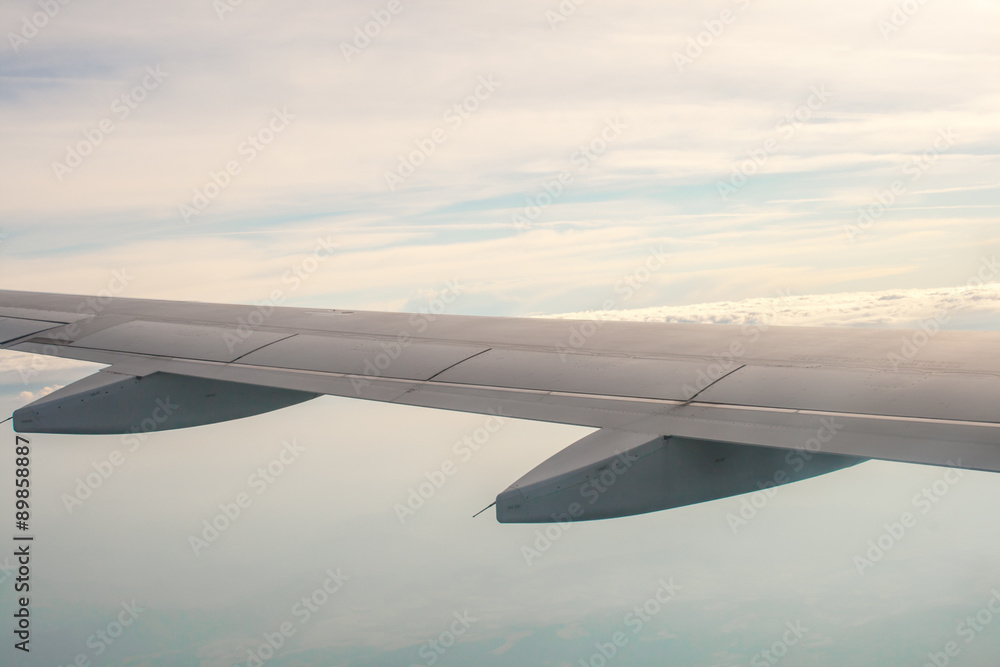 Obraz premium view from the plane on the wing and clouds