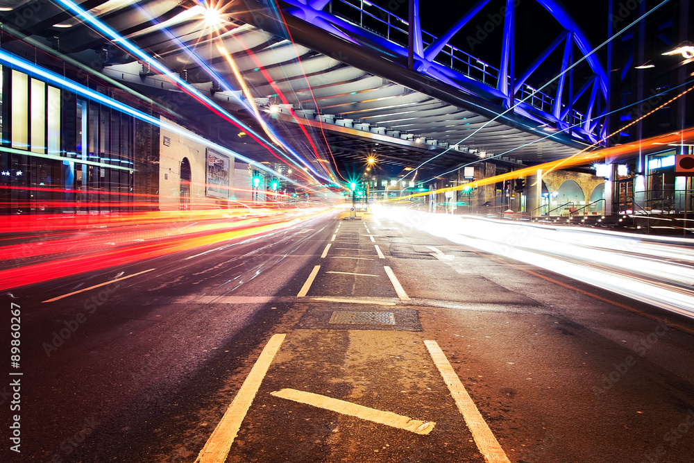 Light trails in City of London with bridge